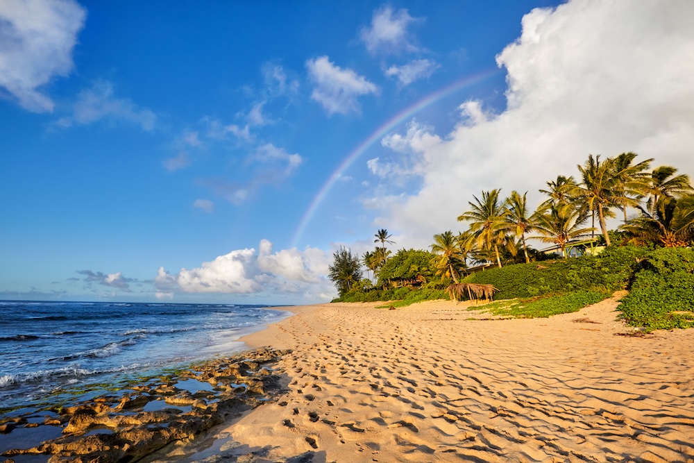 rainbow scenic view over the popular surfing place Sunset Beach, North Shore, Oahu, Hawaii