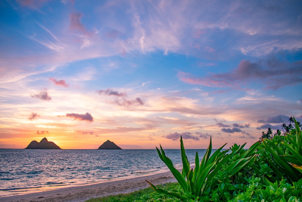 A gorgeous tropical sunrise over Lanikai Beach in Kailua, Oahu, Hawaii