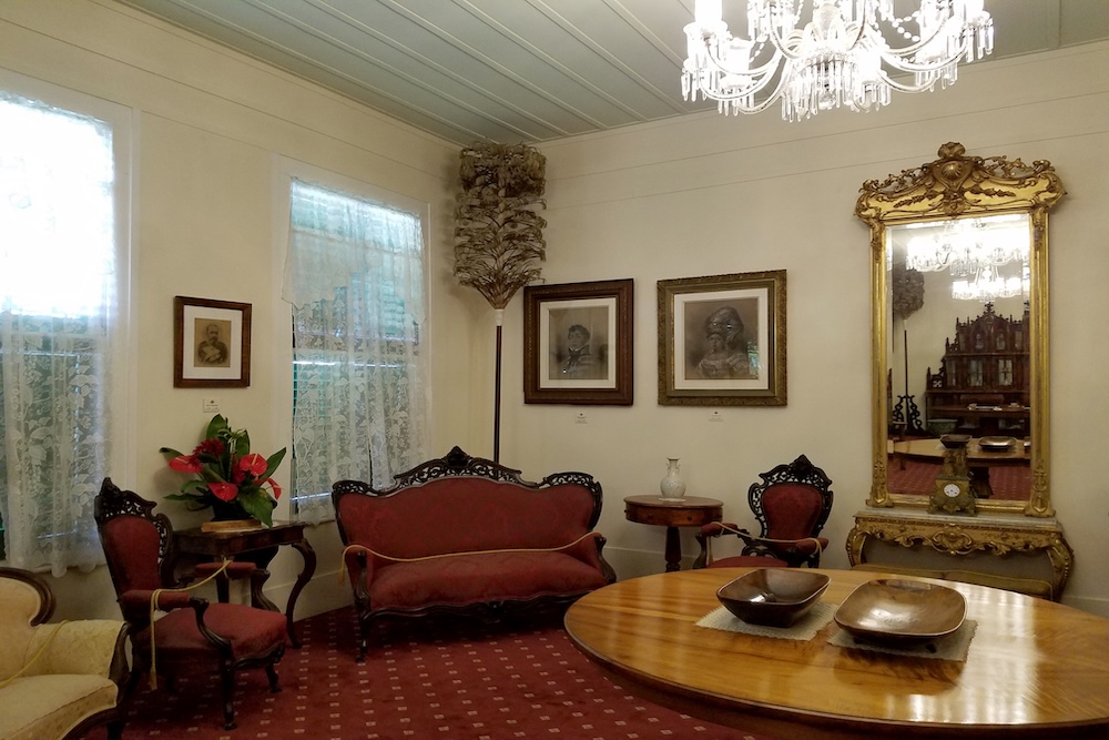 Royal Room with Portraits of Kings, table, and Seats inside Queen Emma Summer Palace