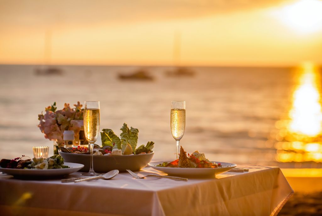 romantic dinner for two overlooking sunset on ocean